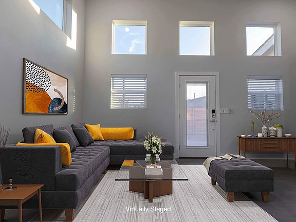 Great room; entry to fenced courtyard