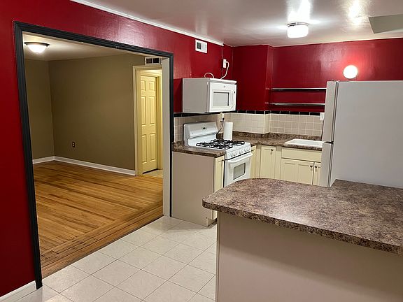 The kitchen adjoins the dining area and living room.