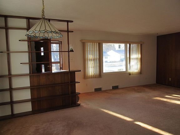 This is the living room with an area for a dining table off the kitchen.