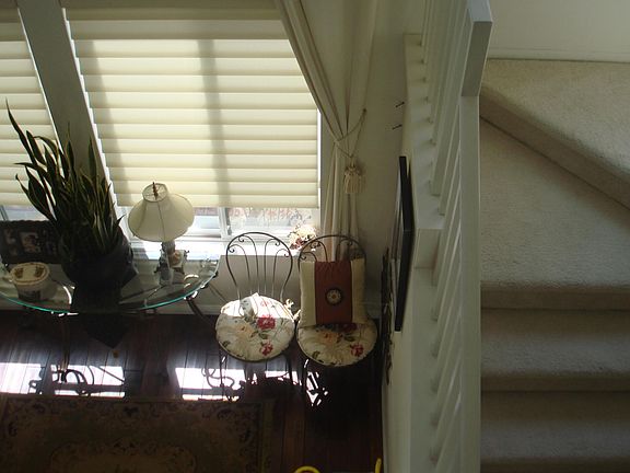 HIGH CEILING LIVING ROOM AND STAIRWAY FROM 2ND FLOOR HALLWAY