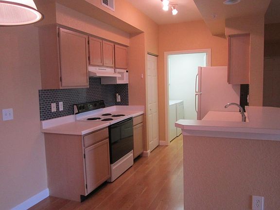 Kitchen looking into laundry