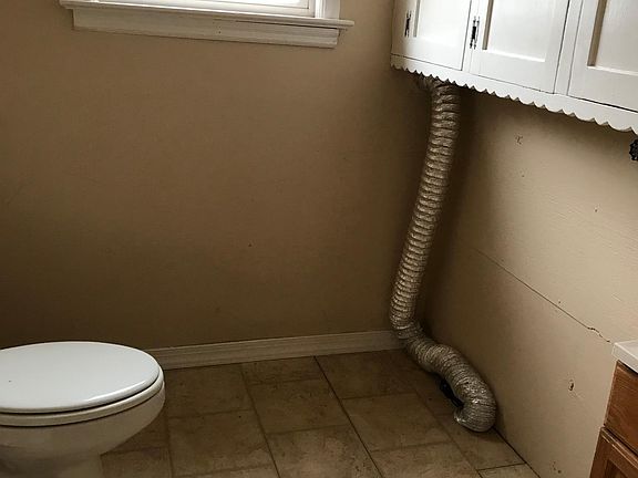 First floor half bath and laundry room 