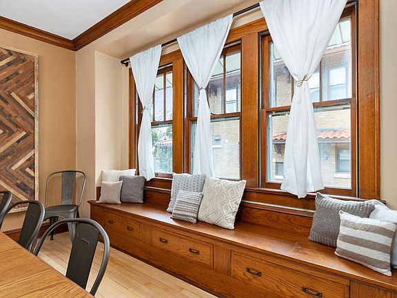 Gorgeous barn wood artwork anchors the dining room.