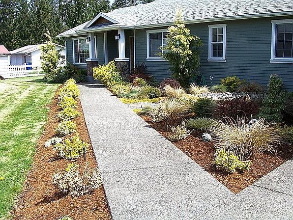 This inviting walk-way leads you to the front door of your dream home.