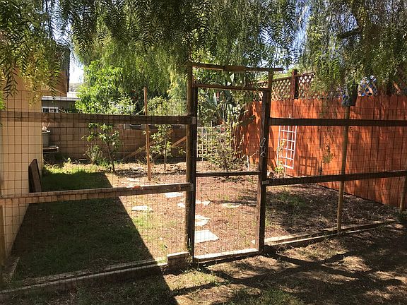 Garden area behind two-car garage.