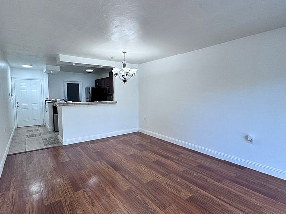 Entrance, Open kitchen with electric stove, Fridge, large sink