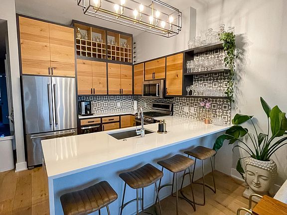 New light fixtures in the kitchen and dining room and additional wine storage added.