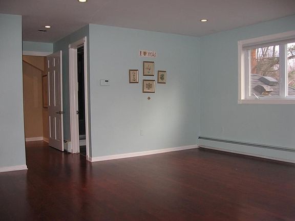 Bedroom with Cherry wood floors
