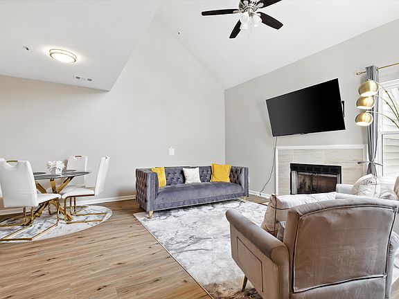 Large living room with space for a dining table. Comes with a ceiling fan and lights.