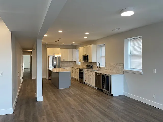 Massive space to set up a dining room, home office, AND living room.