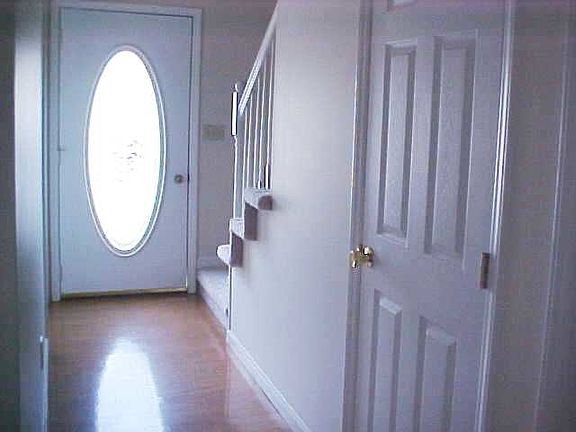 Foyer with coat closet/oak floor