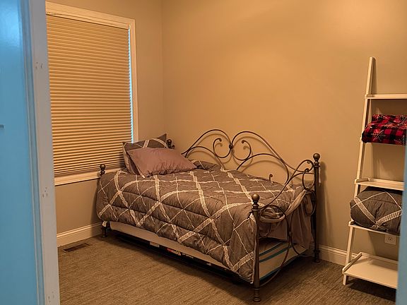 Upper Level bedroom, has nice size closet, and complete with dresser and nightstand.