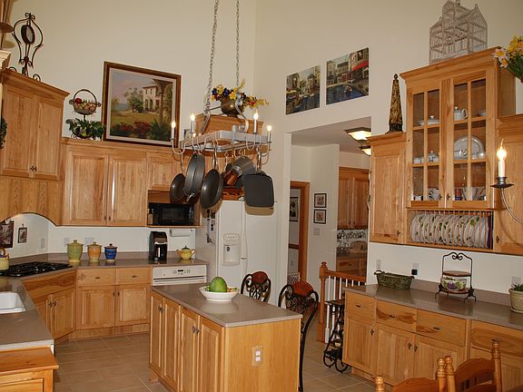 2 story kitchen hickory cab. and corian