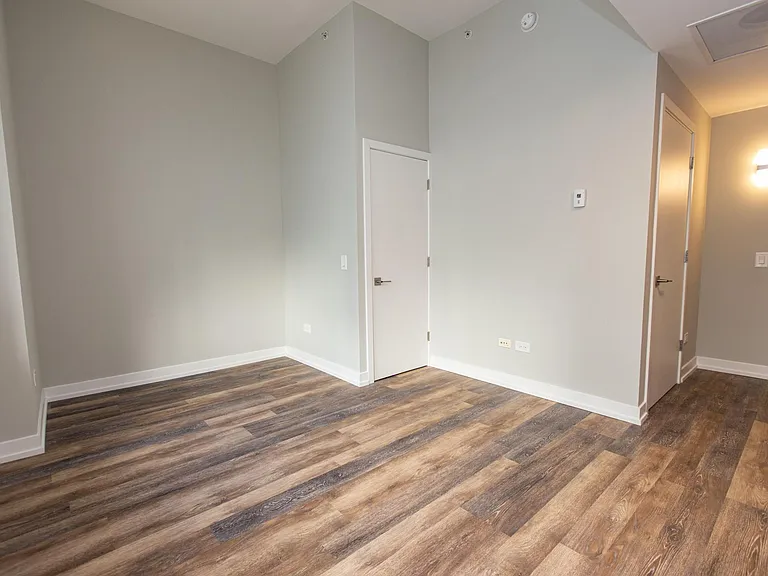 12' ceilings, fully remodeled apartments with new flooring, light fixtures and contemporary roller shades covering 8' windows in all apartments.