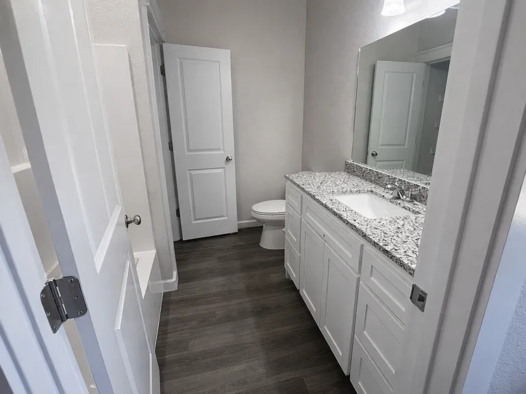 Full bath with modern fixtures and ample counter space.