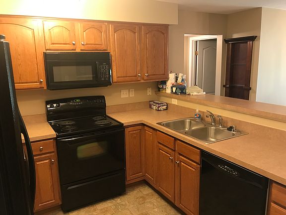 Medium stained wood cabinets