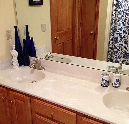 Full bathroom off of the living room
						:
						It has a double vanity with a large mirror as well as a shower.