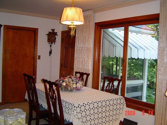 Dining room shows screened porch