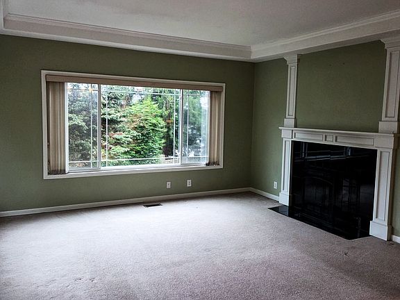 Wood-burning fireplace anchoring the main living area.