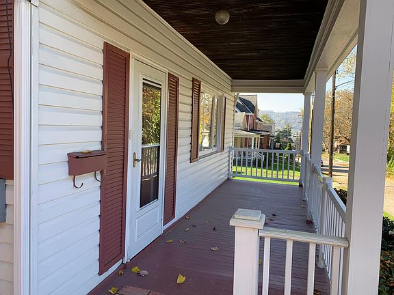 The front porch is spacious enough for rockers and a swing!