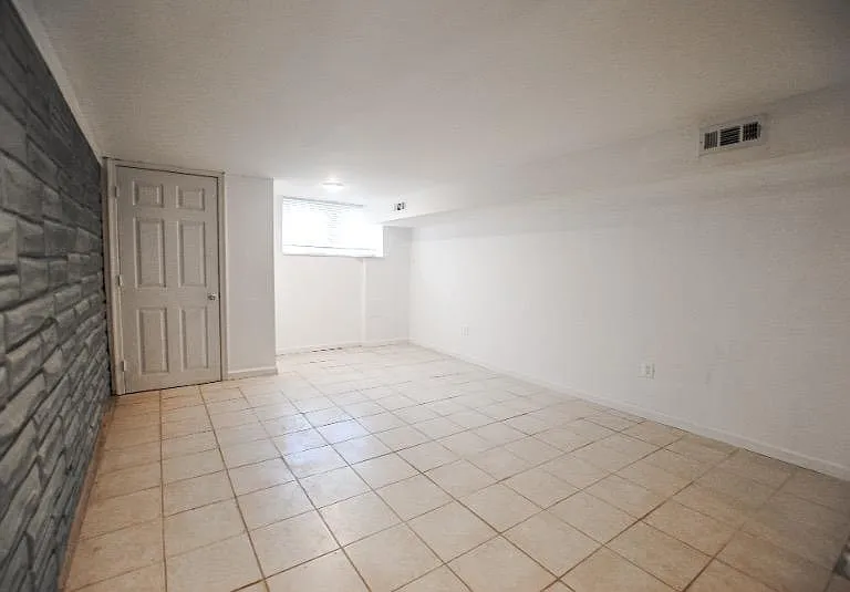 Head downstairs to the finished basement with washer and dryer