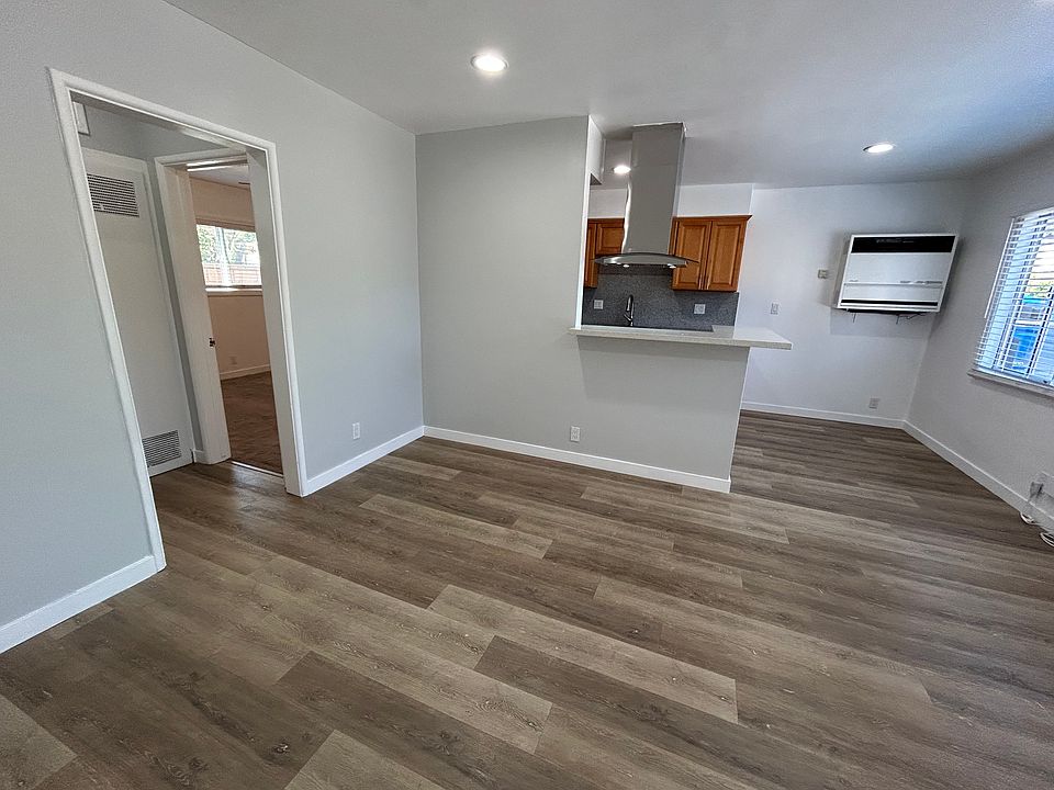 Living room, kitchen in back, entrance to bedroom and bathroom on the left.