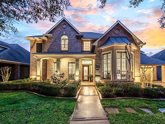 There is an oversize three car tandem garage and a porter cache. The residence has been extensively updated and is in pristine condition.