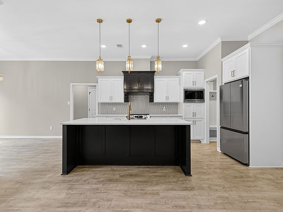 Kitchen is equipped with all stainless appliances.