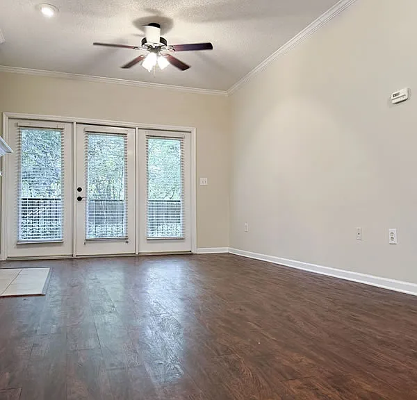 Great room from the front with door to the private porch in back.