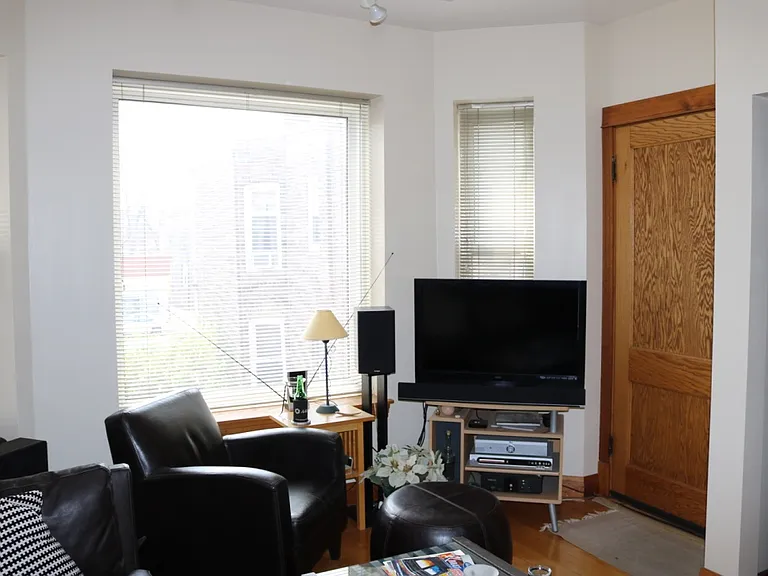 Large front window facing south providing tremendous natural light. Entrance door.