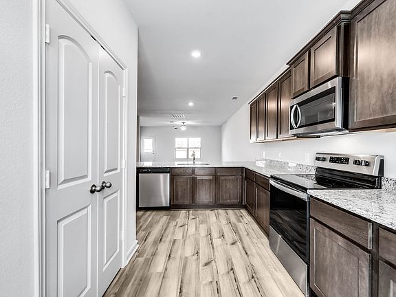 The spacious kitchen is perfect for preparing your family s favorite meals and treats.
