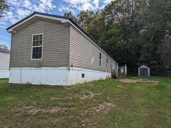 Side entrance view with large 8x8 porch off the sliding glass door