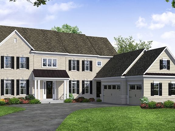 Front elevation of a Stone home from Garman Builders
