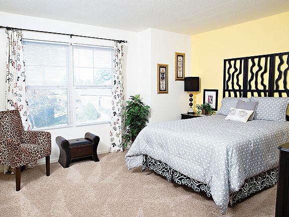 Bedroom with large bed and natural light