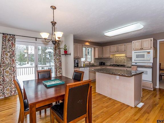 Wood floors, door to deck and rear yard.