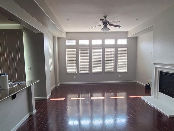 the great room before 1 of 3 new ceiling fans with LED were installed