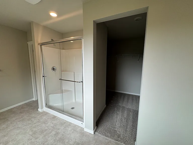 Master shower and spacious closet entrance.