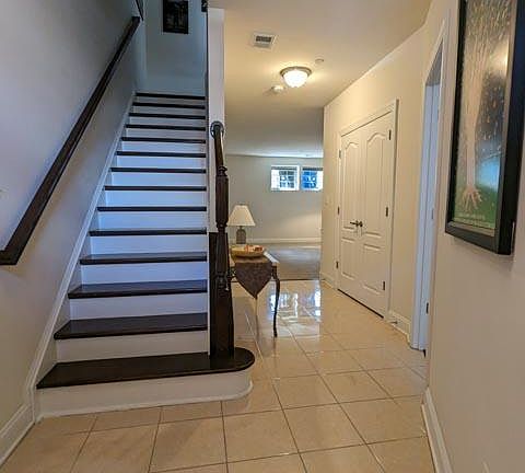 Front door private entry way leading to foyer and upstairs kitchen
