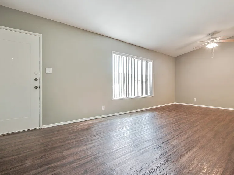 Living room and Dining area with ceiling fan, wood-style floors throughout