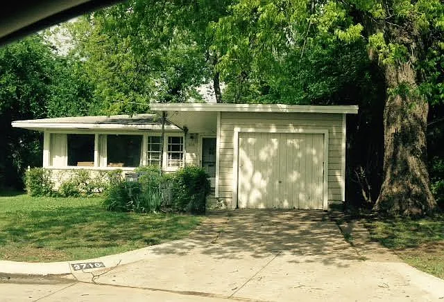 Front of the home, including garage and carport