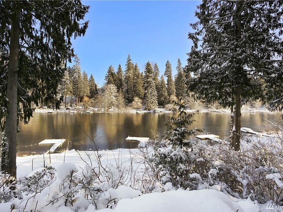 Enjoy 60 feet of lakeside waterfront: Paddleboard, canoe or fish from the private dock. Set up croquet or badminton on the large, level lawn. Or, just relax in an Adirondack chair by the firepit.