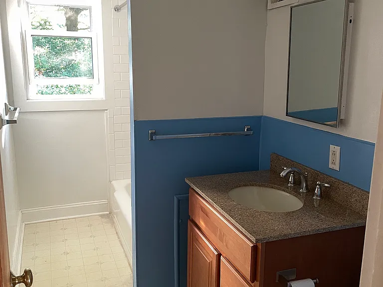 Bathroom with tub and shower