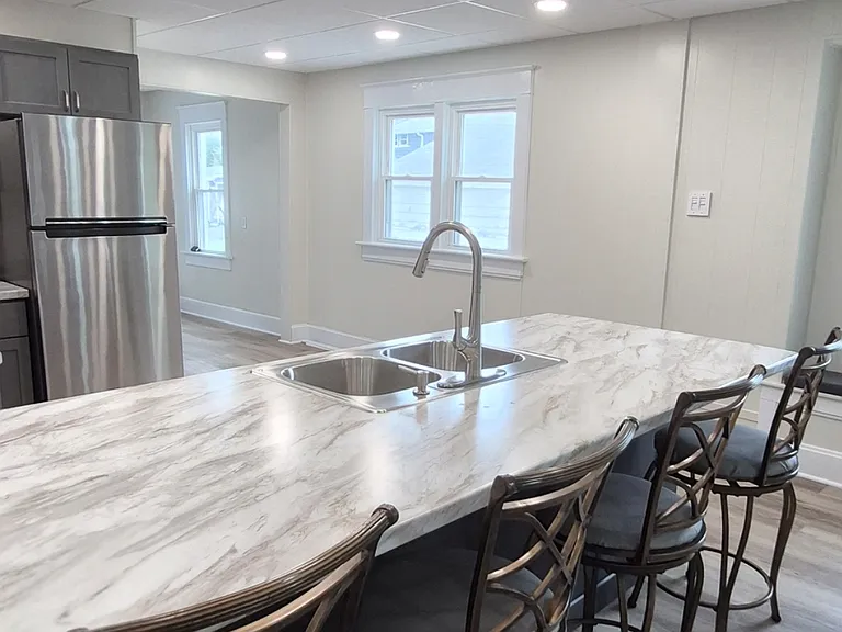 Kitchen prep space, dining table, social space, buffet table - lots of uses!