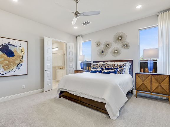 Primary bedroom in the Pinot home plan by Trophy Signature Homes - REPRESENTATIVE PHOTO