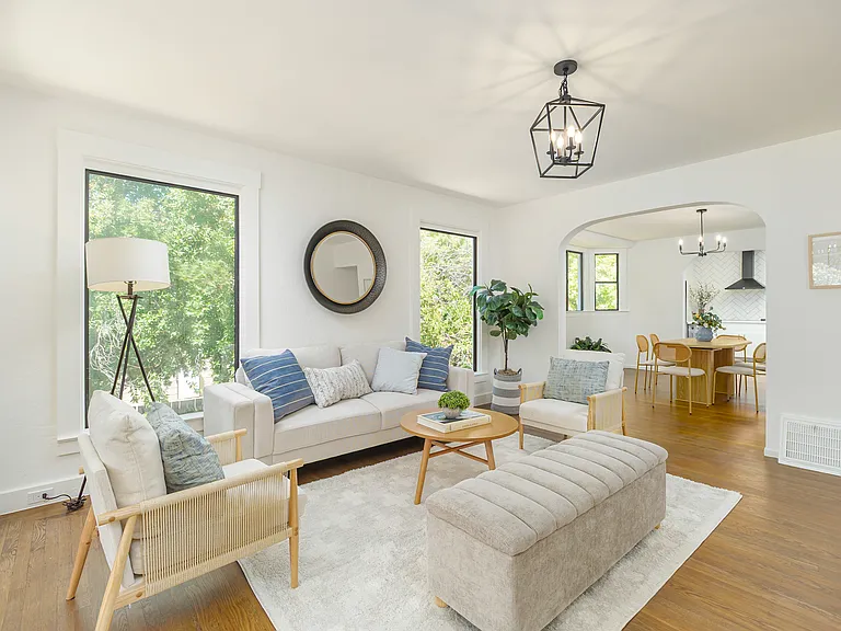 Light-filled living room that flows to dining room and kitchen