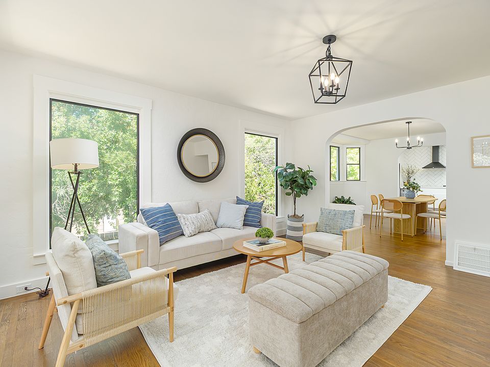 Light-filled living room that flows to dining room and kitchen