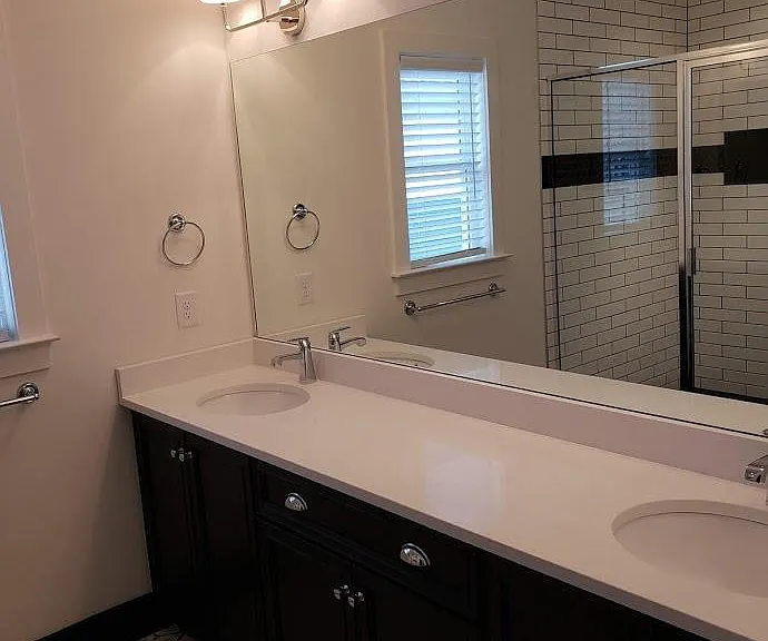Upstairs master bathroom shoeing double vanity and shower.