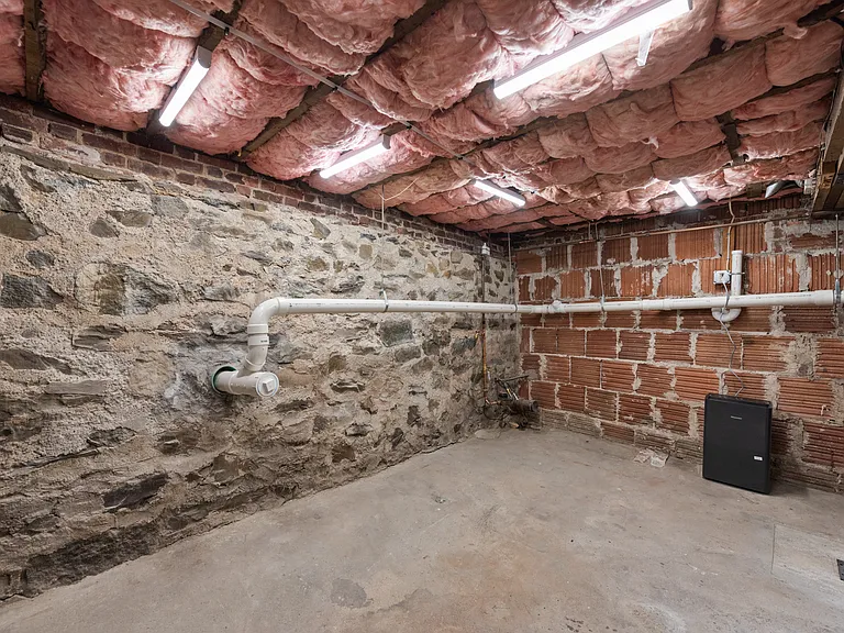 The house has solid infrastructure improvements including new structural supports, fiberglass insulation, all new plumbing, electric, and an energy efficient gas-fired heating system. New door and bulkhead too.