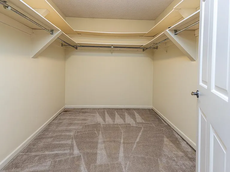 Upstairs walk in closet off hallway.