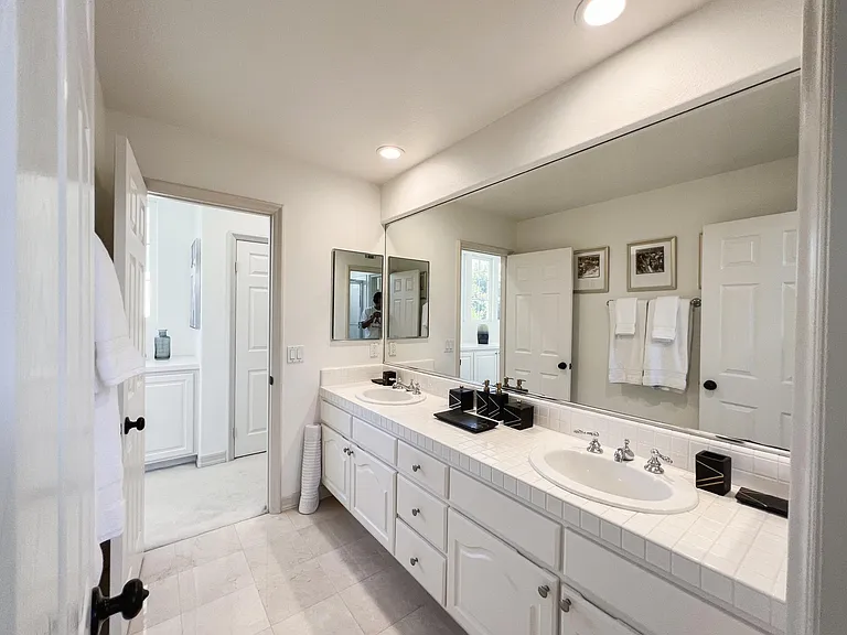 Bathroom 3 (hallway entry - and entry through Bedroom 3. Dual vanity. shared bath for bedrooms 3 & 4). Separate water closet/shower room.